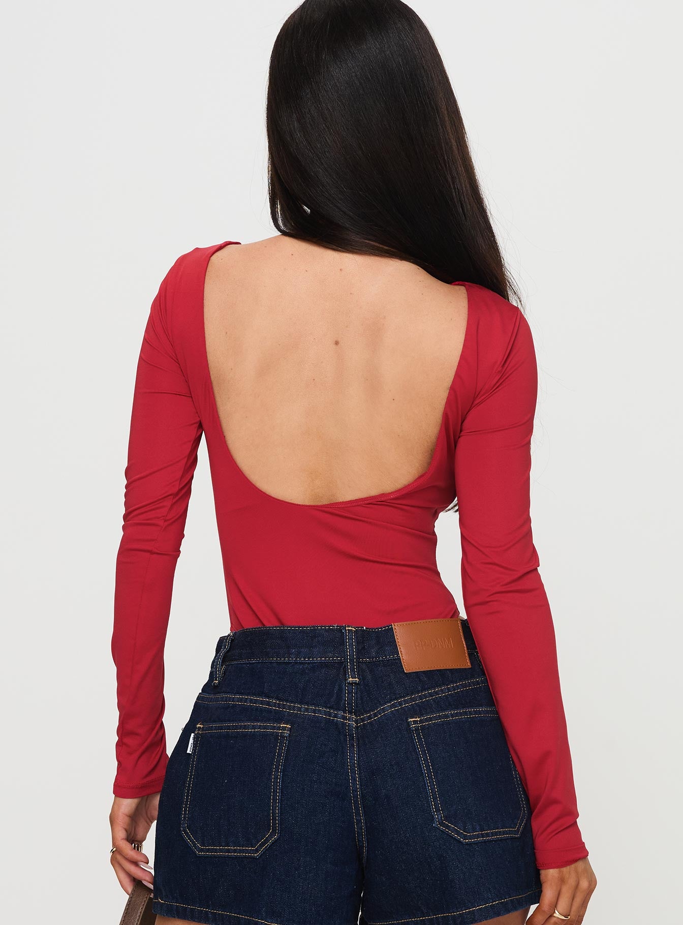 back view of model wearing Princess Polly Beresford Long Sleeve Bodysuit Wine Full Sleeves 