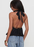 back view of model wearing Princess Polly Saddler Halter Top Black Sleeveless Plunger 