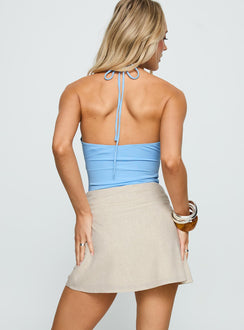 back view of model wearing Princess Polly Haisel Mini Skirt Beige Mini Skirts 