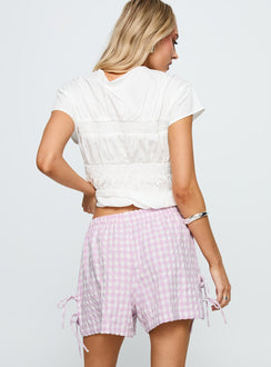 back view of model wearing Princess Polly Bubbia Tie Up Shorts Purple / White 