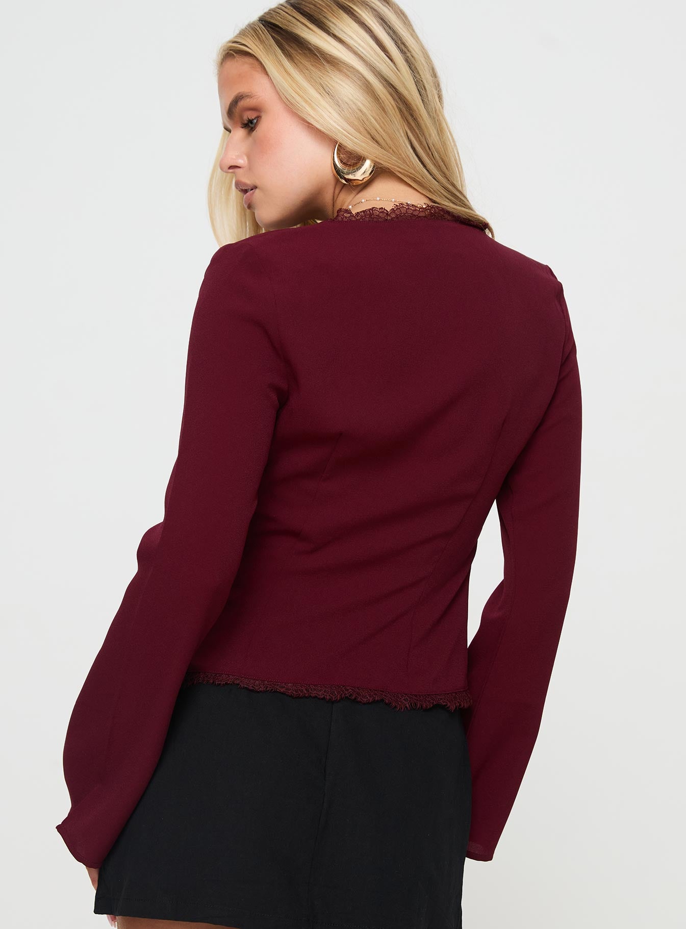 back view of model wearing Princess Polly Hagner Long Sleeve Top Burgundy Full Sleeves V-Neck 
