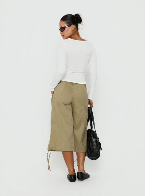 Presenting the Iria Capri Trouser Khaki womens-regular-pants with mid-rise waist back view of model wearing Princess Polly
