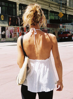 back view of model wearing Princess Polly Flutter Halter Top White Sleeveless High Neck 