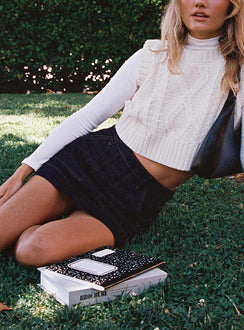   side view of model wearing Princess Polly Hughes Mini Skirt Dark Wash Denim Petite Mini Skirts 