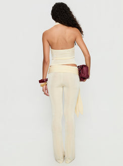 back view of model wearing Princess Polly Butterfly Tie Detail Pants Lemontini Mid Rise Pants 