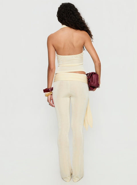 back view of model wearing Princess Polly Butterfly Tie Detail Pants Lemontini Mid Rise Pants 