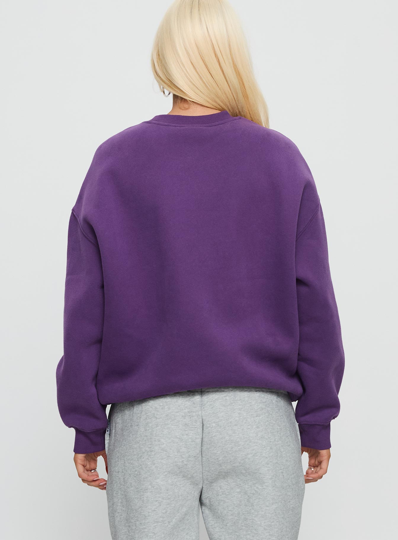 back view of model wearing Princess Polly NYU Offside Crewneck Sweatshirt Purple 