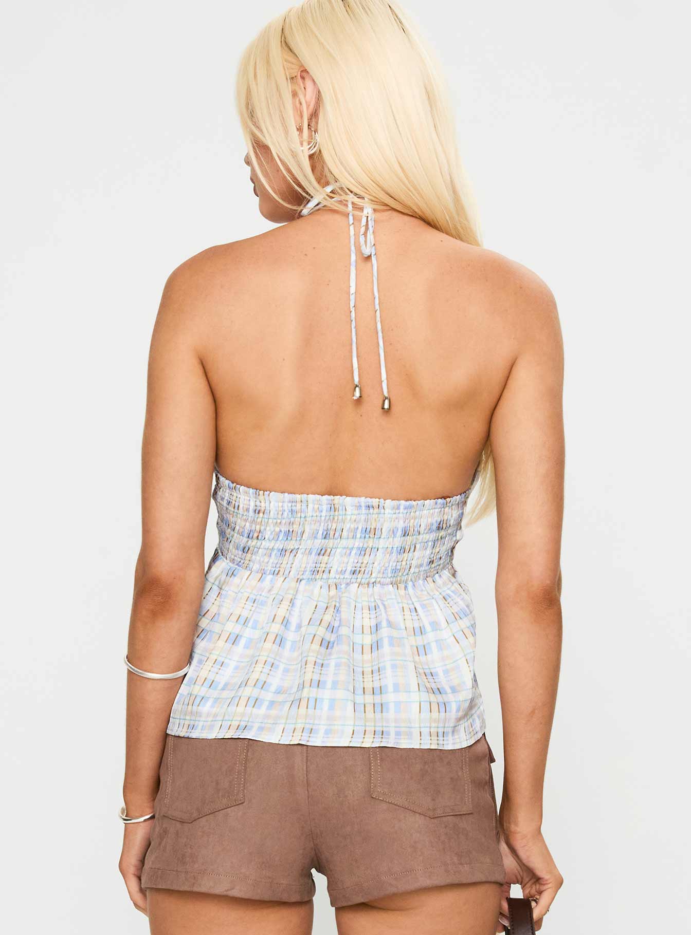back view of model wearing Princess Polly Gadot Halter Top Blue Check Sleeveless Plunger 