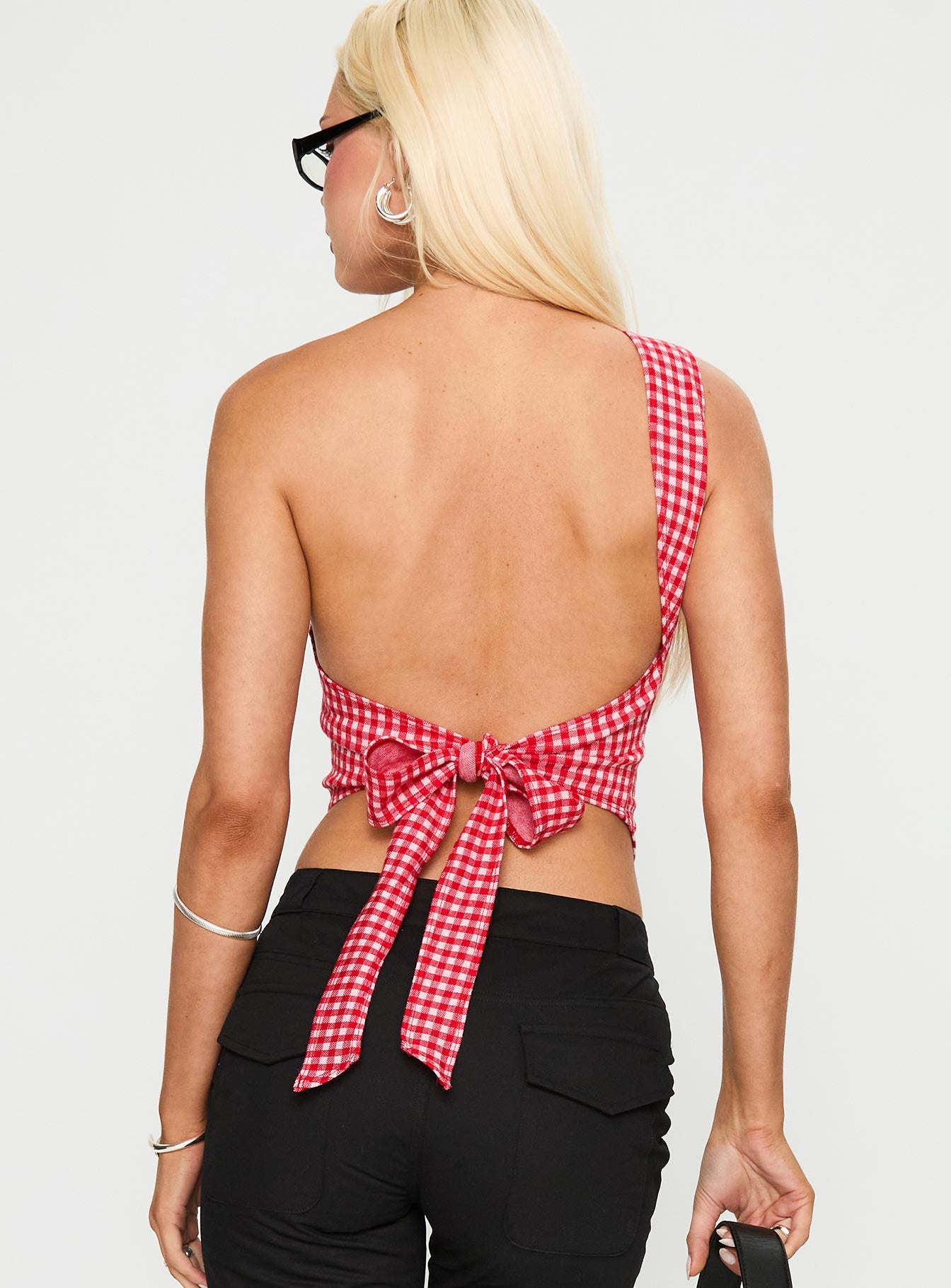 back view of model wearing Princess Polly Sunday Sunrise Tie Back Top Red Check Sleeveless Asymmetric Neckline 