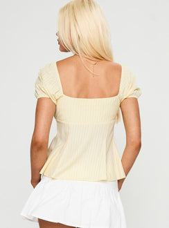 back view of model wearing Princess Polly How To Fly Tie Detail Top Yellow Short Sleeves Square Neck 