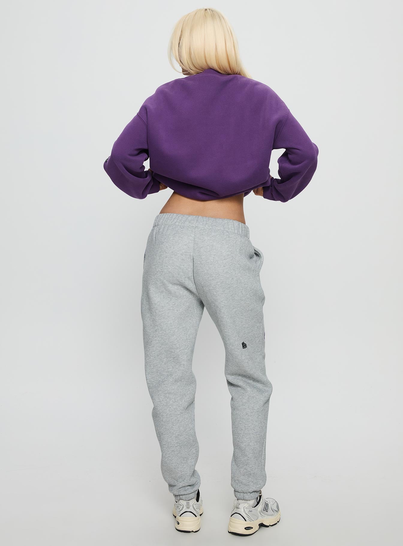 back view of model wearing Princess Polly NYU Basic Sweatpants Heather Grey Mid Rise Pants 