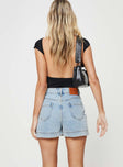 back view of model wearing Princess Polly Gazelle Denim Skort Light Wash Lower Impact High Waisted Shorts 