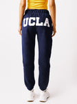 back view of model wearing Princess Polly UCLA Sweatpants Navy High Waisted Pants 