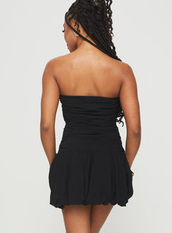back view of model wearing Princess Polly Glamour Girl Strapless Bubble Hem Mini Dress Black Straight Neck 