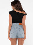 back view of model wearing Princess Polly Laurena Denim Shorts Petite Lower Impact High Waisted Shorts 