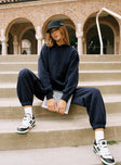 front view of model wearing Princess Polly Dream Fleece Ankle Cuff Sweatpants Navy High Waisted Pants 