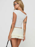 back view of model wearing Princess Polly Deei Double Ruffle Mini Skort Soft Lemon Low Rise Shorts 