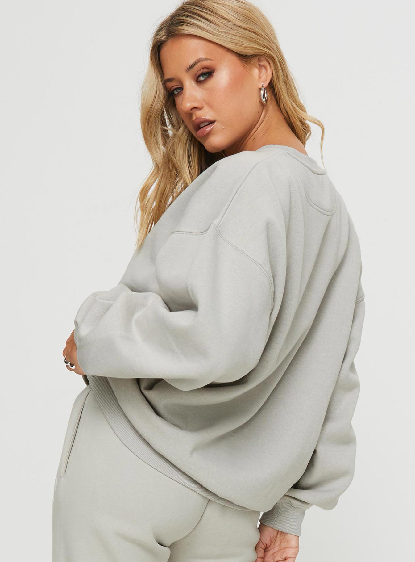 back view of model wearing Princess Polly Princess Polly Crew Neck Sweatshirt Bubble Text Grey / Cloud White Long 