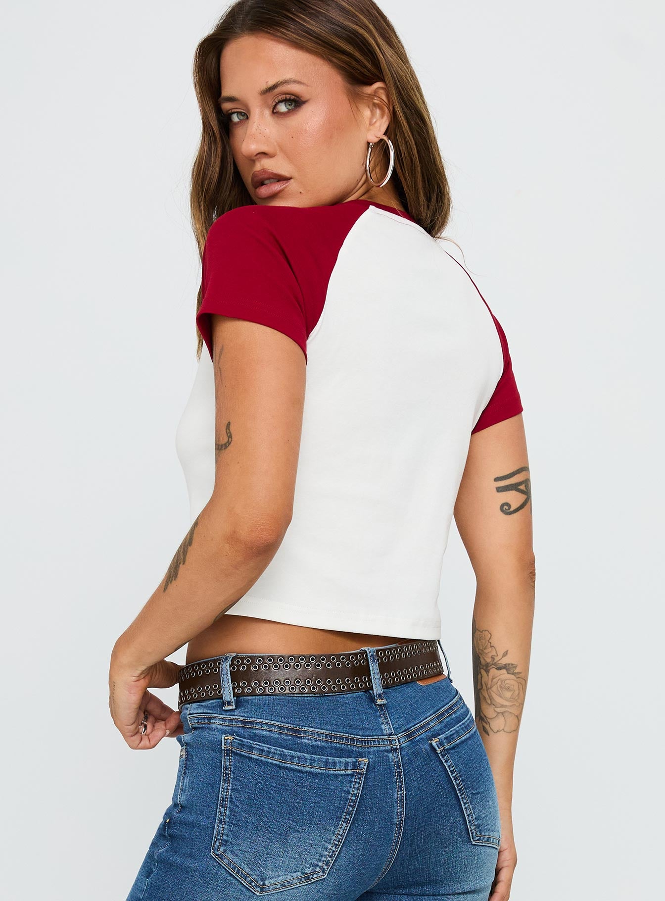 back view of model wearing Princess Polly Let Rock Rule Graphic Top White / Red Short Sleeves Crew Neck 