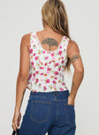 Floral print top Fixed shoulder straps, v-neckline, lace trim, invisible zip fasteing at side Non-stretch material, lined bust