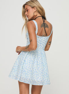 back view of model wearing Princess Polly Gozette Mini Dress Blue Floral Sweetheart Neckline 