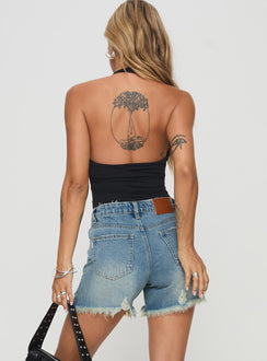 back view of model wearing Princess Polly Tranquility Shorts Light Wash High Waisted Shorts 