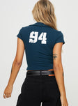 Top Graphic on back, classic collar, deep V-neckline, cap sleeves, faux twin chest pockets Double zipper fastening at front 