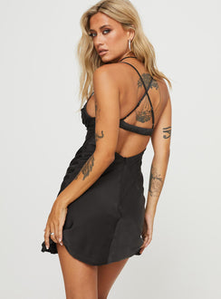 back view of model wearing Princess Polly Glendon Mini Dress Black Sweetheart Neckline 