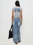 back view of model wearing Princess Polly Skipper Low Rise Baggy Jeans Vintage Blue Low Rise Jeans 