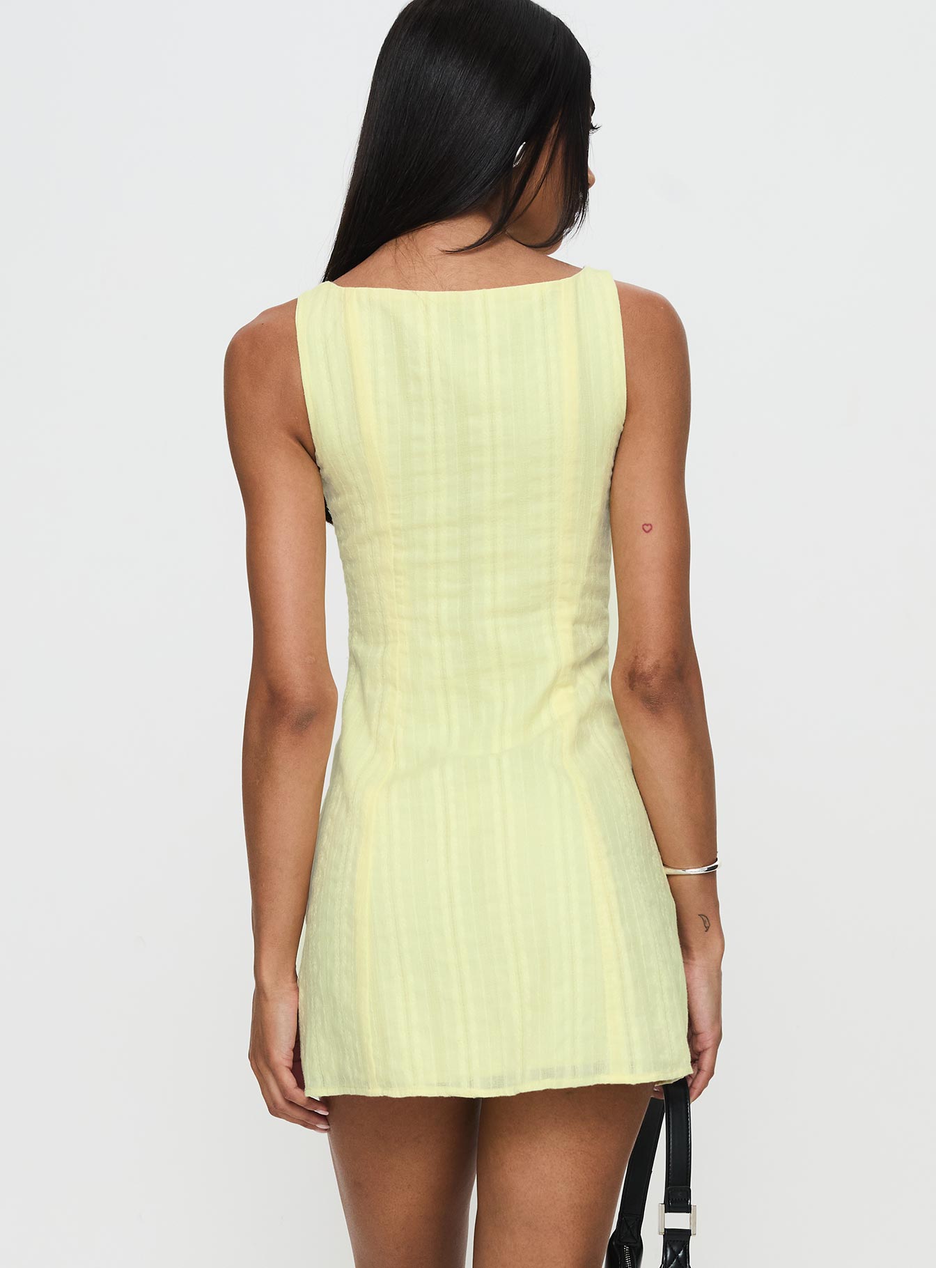 back view of model wearing Princess Polly Mimsie Embroidered Mini Dress Lemon Boat Neck 