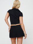 back view of model wearing Princess Polly Gigi Skort Black High Waisted Shorts 