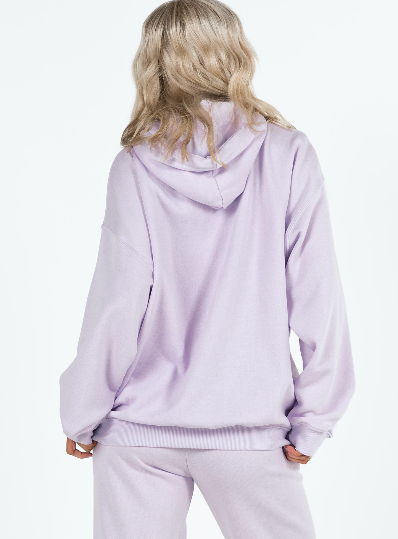 side view of model wearing Princess Polly Princess Polly Hooded Sweatshirt Squiggle Text Dusty Mauve / Eggshell regular 