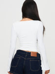 back view of model wearing Princess Polly Sampson Long Sleeve Top White Full Sleeves Plunger 