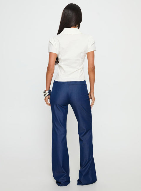 back view of model wearing Princess Polly Kinkirk Flared Pants Chambray Mid Rise Pants 