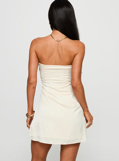 back view of model wearing Princess Polly Irena Strapless Mini Dress Champagne Sweetheart Neckline 