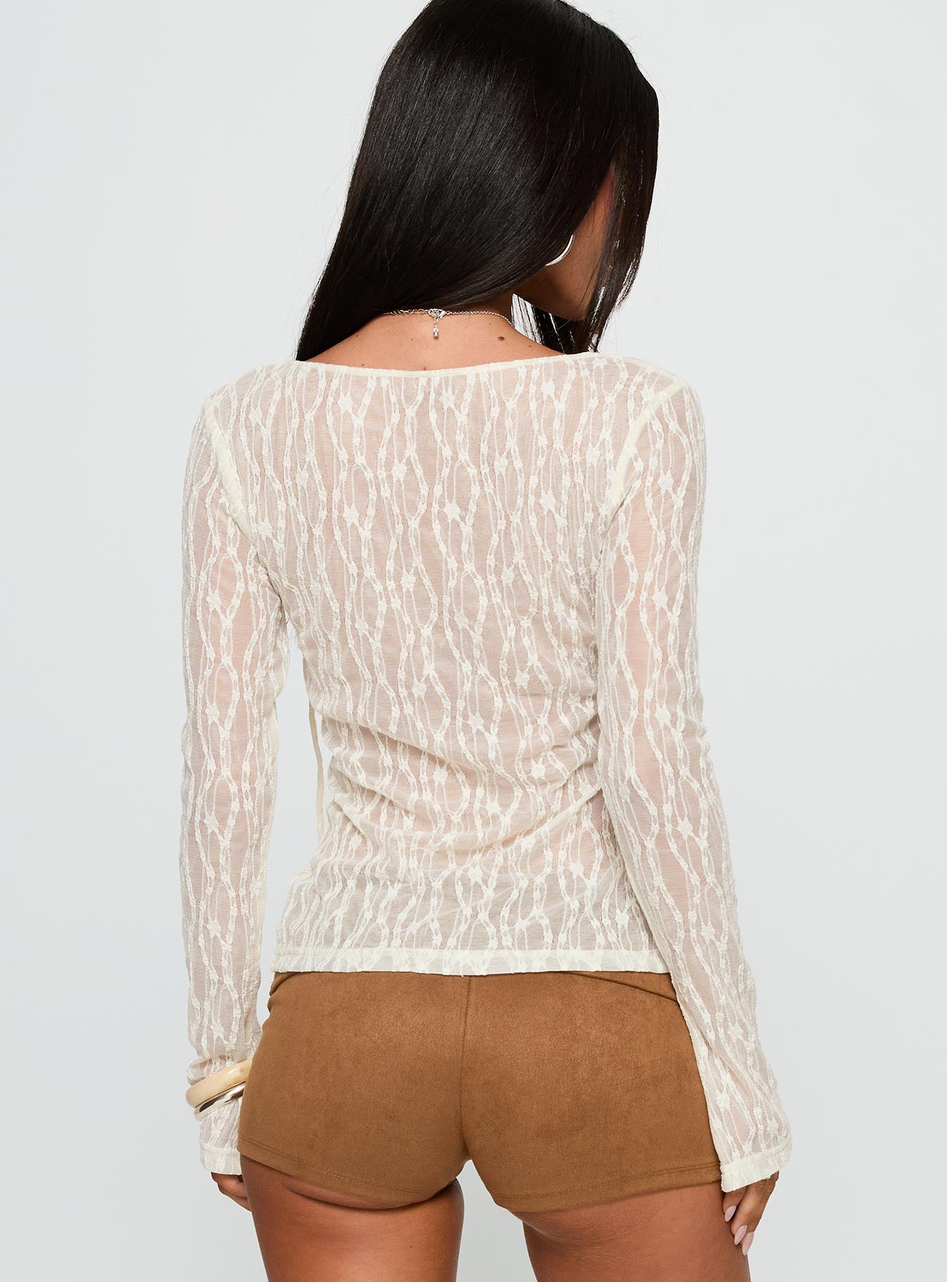 back view of model wearing Princess Polly Open Your Heart Tie Detail Long Sleeve Top Cream Full Sleeves Scoop Neck 
