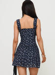 back view of model wearing Princess Polly Dasha Mini Dress Navy Floral Square Neck 