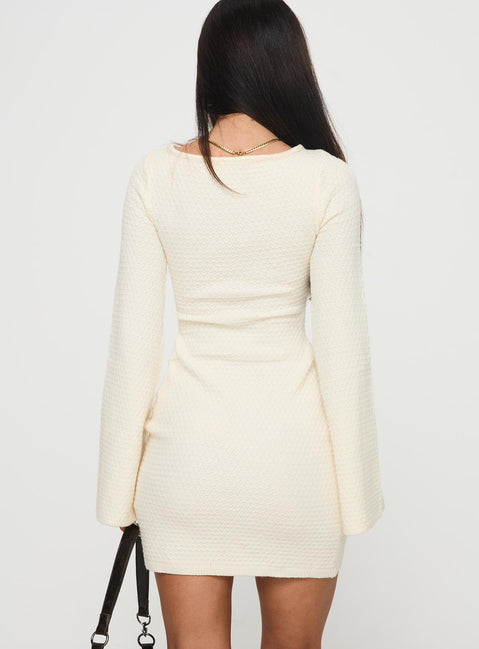 back view of model wearing Princess Polly Malcalm Long Sleeve Mini Dress Cream Crew Neck 