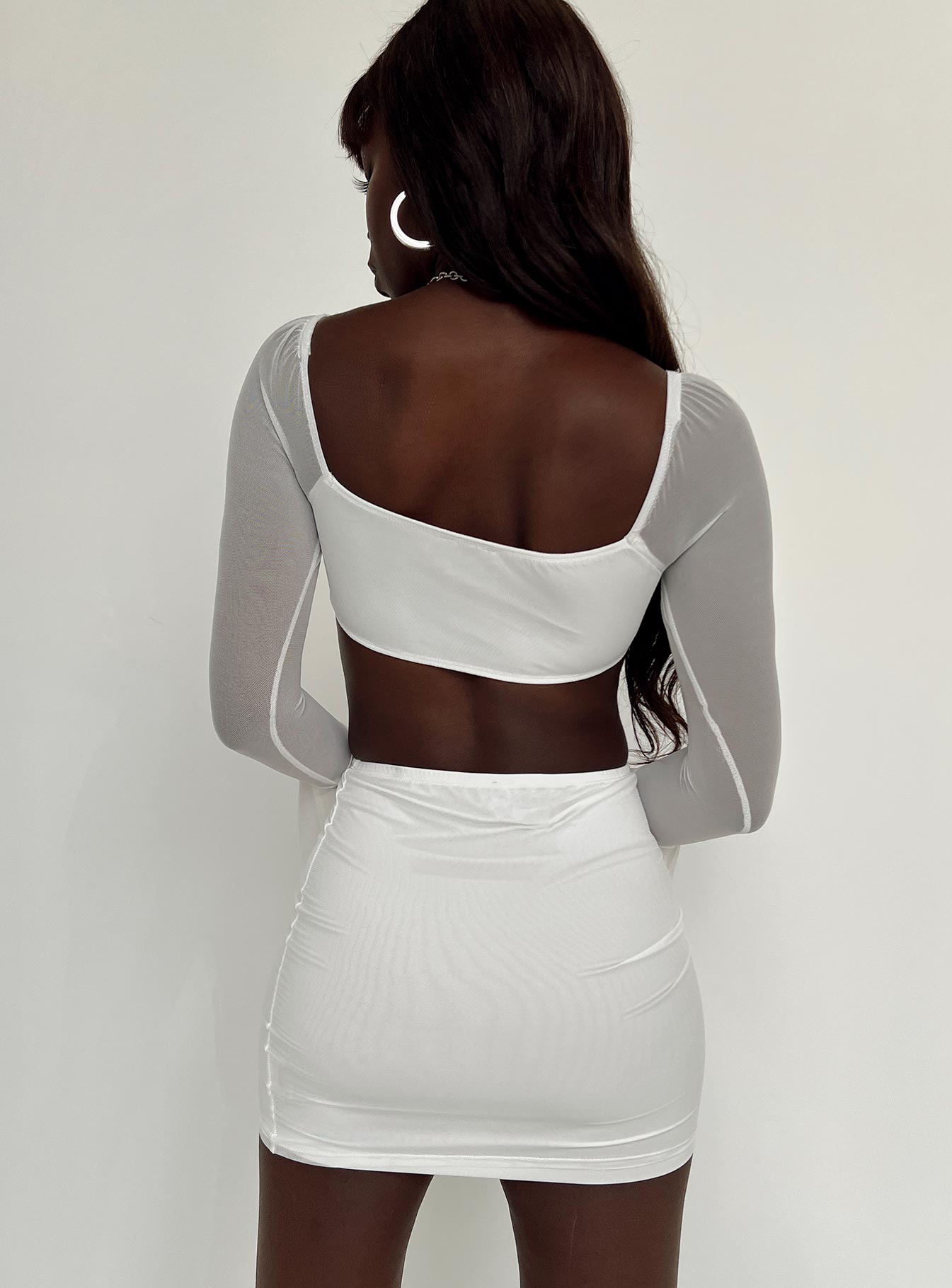 Matching set Mesh material  Long sleeve crop top  Wired cups  High waisted mini skirt  Elasticated waistband  Good stretch  Lined body  Sheer sleeves 