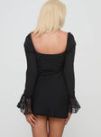 back view of model wearing Princess Polly Softer Side Long Sleeve Mini Dress Black Sweetheart Neckline 