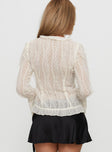 back view of model wearing Princess Polly Sainz Frill Long Sleeve Top Cream Full Sleeves V-Neck 