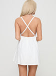 back view of model wearing Princess Polly Cona Mini Dress White V-Neck 