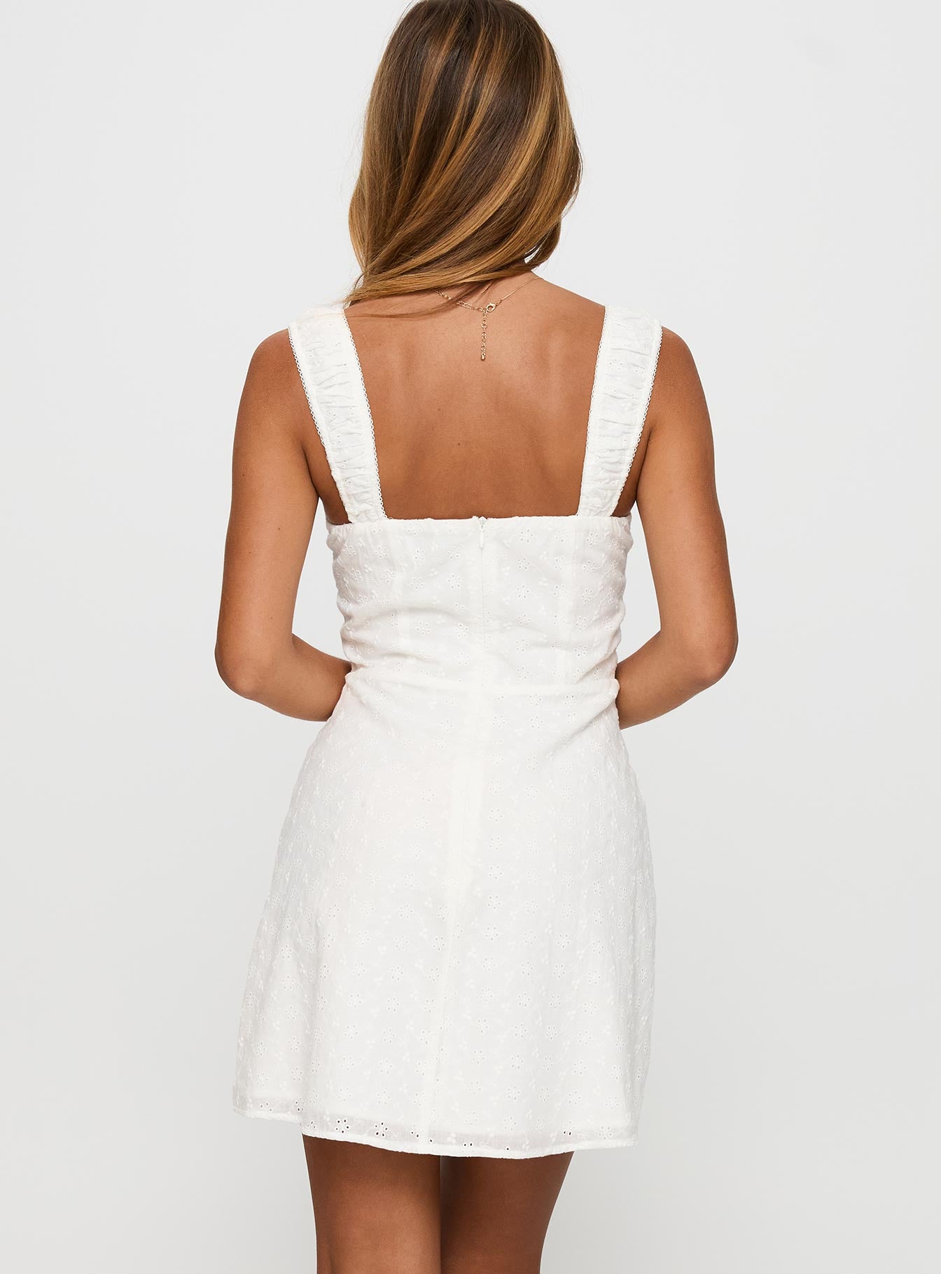 back view of model wearing Princess Polly Sweet Secrets Broderie Mini Dress White Sweetheart Neckline 