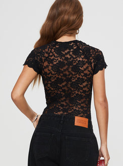 back view of model wearing Princess Polly Giallo Bodysuit Black Short Sleeve 