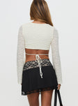 back view of model wearing Princess Polly Getaway Car Lace Mini Skirt Black Mini Skirts 