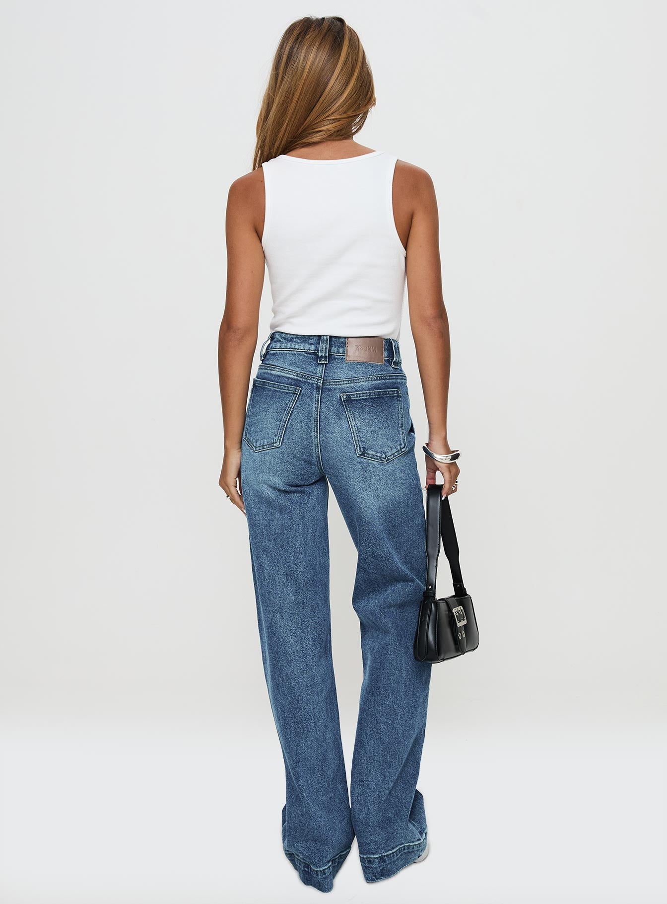 back view of model wearing Princess Polly Carsen Wide Leg Jeans Washed Blue High Waisted 