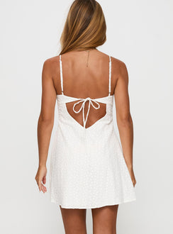 back view of model wearing Princess Polly Dearly Embroidered Mini Dress White Petite V-Neck 
