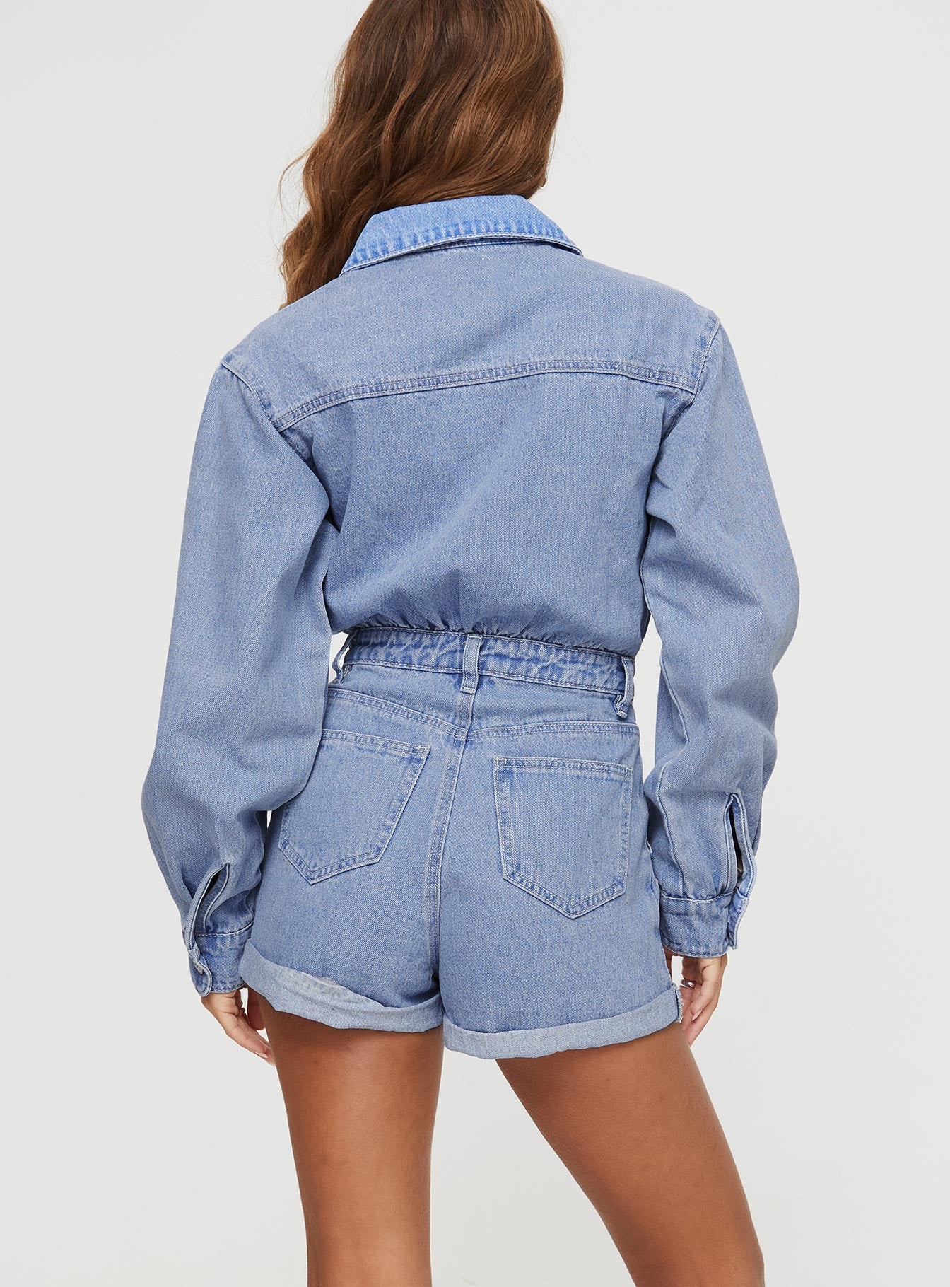 Denim romper Classic collar, button fastening, four pocket design, belt loops at waist