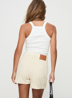 back view of model wearing Princess Polly Gazelle Denim Skort Cream High Waisted Shorts 