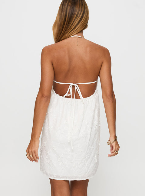 back view of model wearing Princess Polly Daisy Chains Broderie Halter Mini Dress White Scoop Neck 